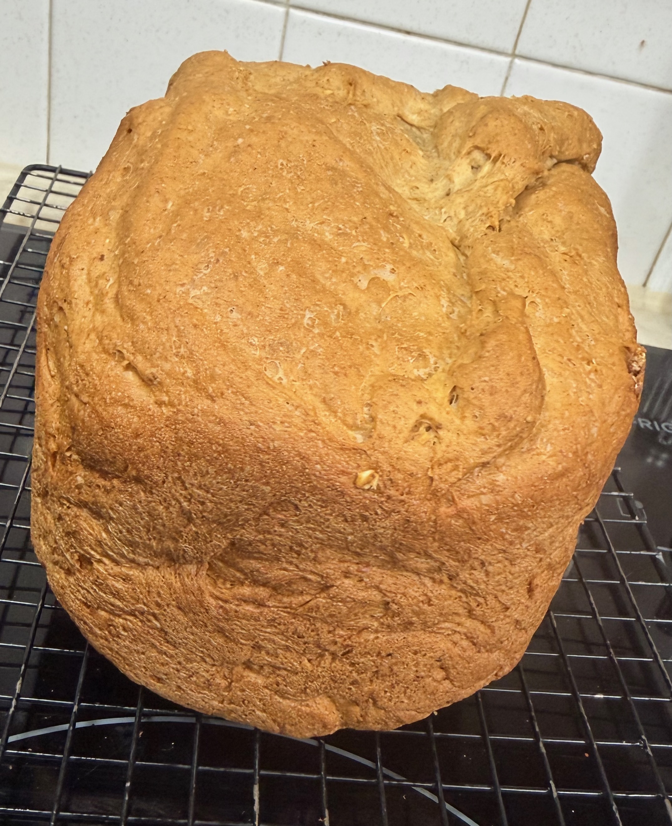 A multigrain bread loaf from the bread machine, sliced to show the hearty whole grain interior